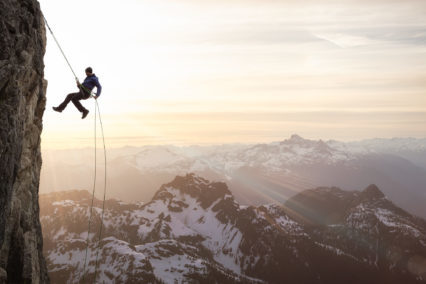 Epic Adventurous Extreme Sport Composite of Rock Climbing Man Rappelling